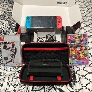 BRAND NEW  NINTENDO SWITCH BUNDLE WITH TWO GAMES AN TO GO CASE ALL BRAND NEW